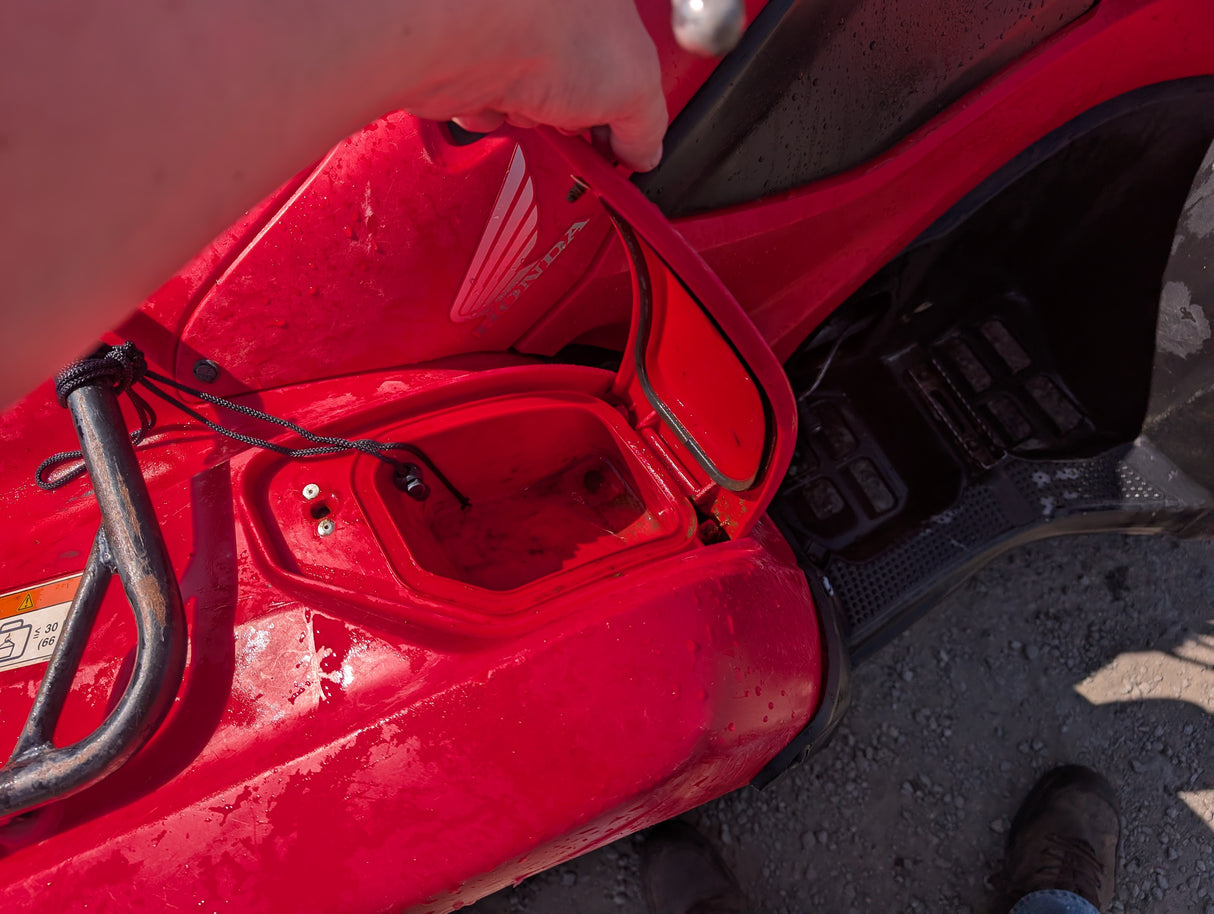 Honda TRX 500 ATV, red body with visible Honda badge.