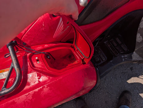 Honda TRX 500 ATV, red body with visible Honda badge.