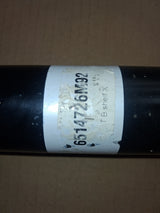 Shaft, black metal drive component with worn white label showing 6514726M92