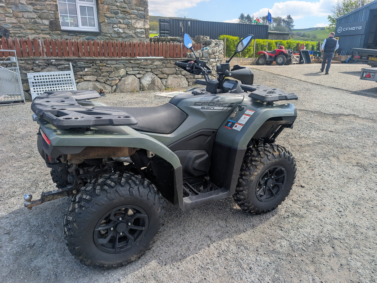 Used CFMOTO CFORCE 520 ATV by DGT Agri, gray with front and rear cargo racks, on gravel.