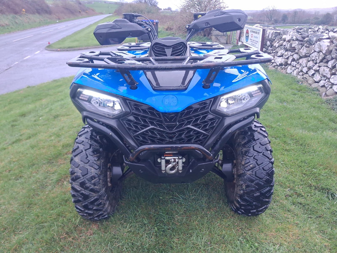 CFMOTO CFORCE 450 ATV front view in blue, 2023 used with winch and rugged tires