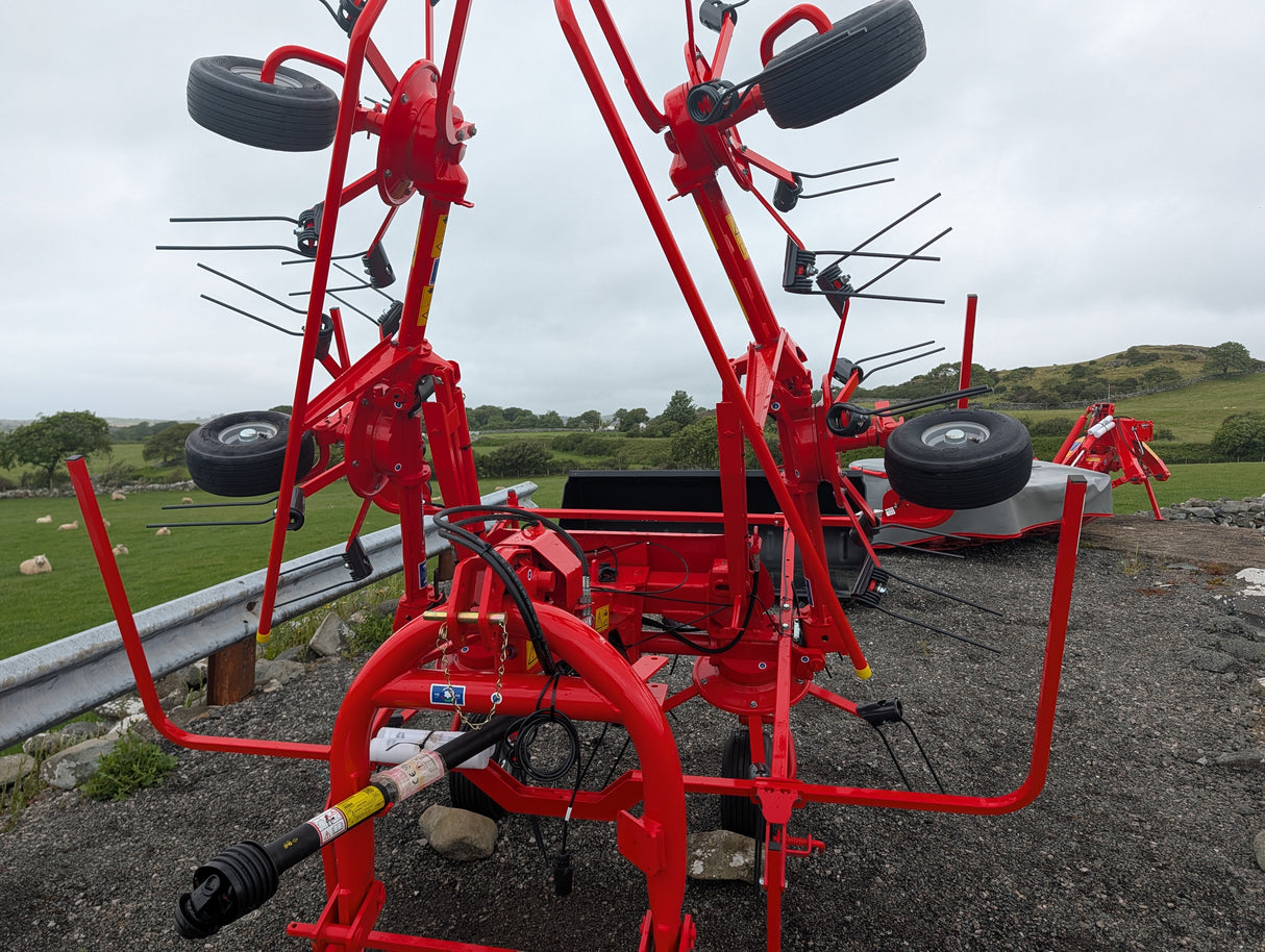 Kuhn GF582 6-rotor tedder in red for straw, hay and silage; agricultural machinery