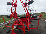 Kuhn GF582 6-rotor tedder in red for straw, hay and silage; agricultural machinery