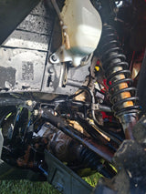 Honda TRX 520 FM6 manual ATV, used; black frame with rust and visible coil-spring suspension.