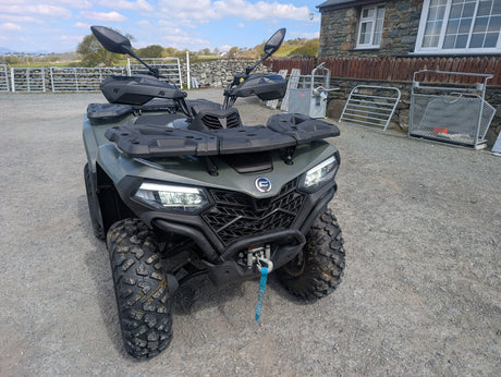 CFMOTO CFORCE 520 ATV, used, dark green with rugged tires and front cargo rack
