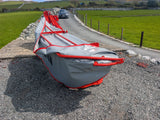 KUHN GMD 240-FF 2.4m 6-disc disc mower on rural road; red frame, grey cover.